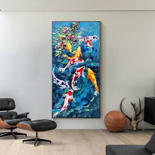 Colorful koi fish textured oil painting with blue water and flowering branch in a modern interior