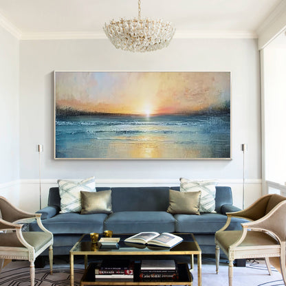Large coastal canvas artwork above modern living room sofa