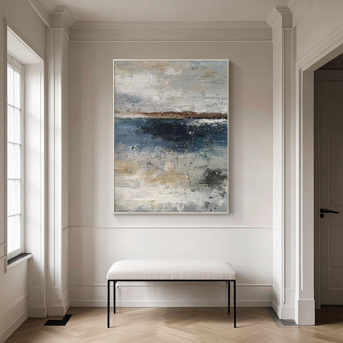 Modern navy blue wall art above a contemporary living room sofa